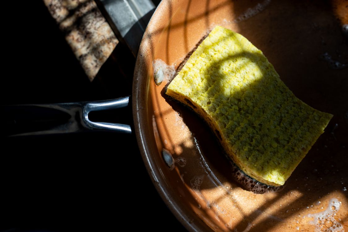 A soft sponge resting inside a pan